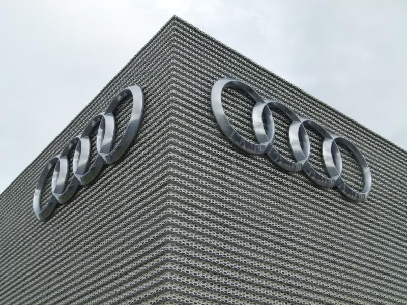 Audi logos on the side of a building.
