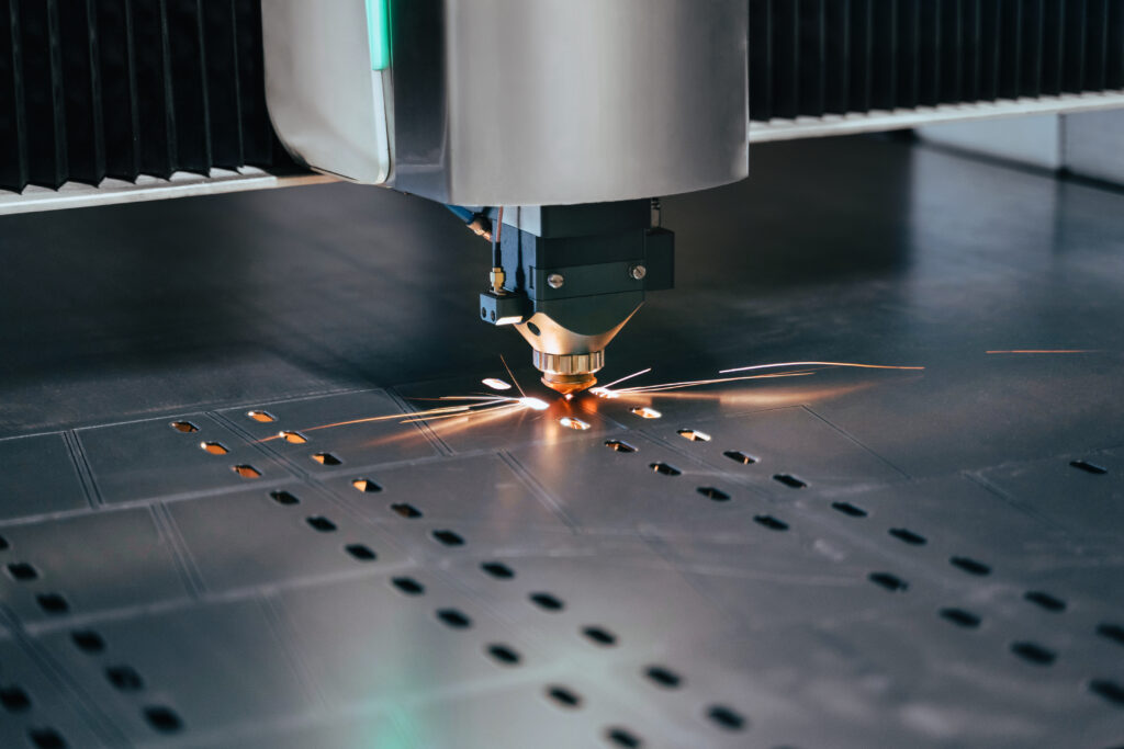 A cnc machine is cutting metal with sparks.